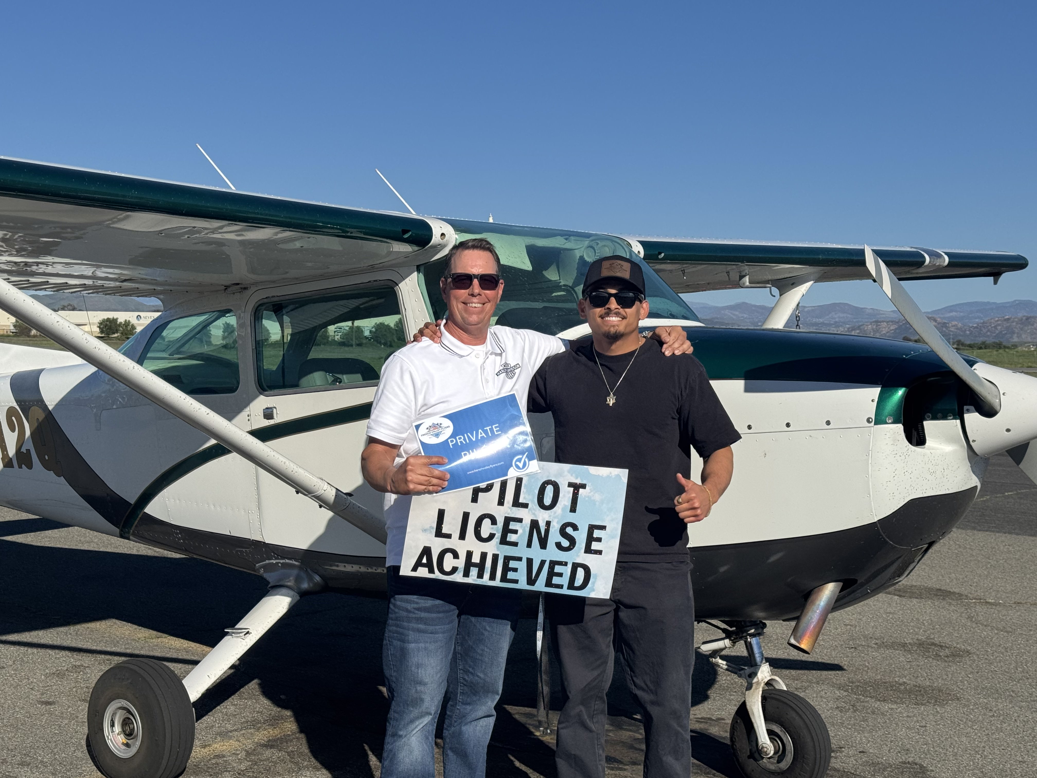 Student celebrating Private Pilot License at French Valley Airport